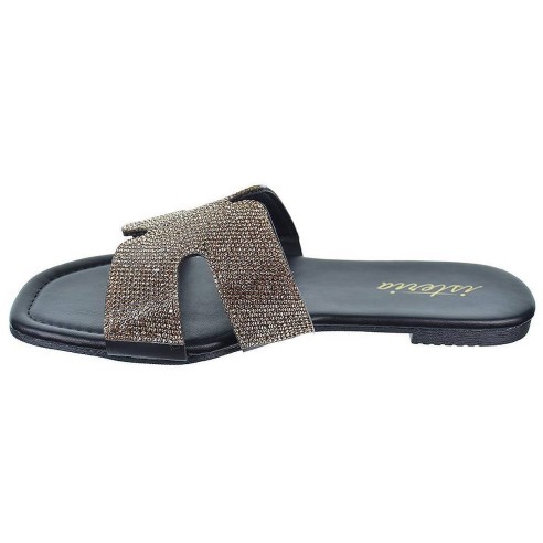 Isteria Zueco sintético con fantasía y suela plana de goma muy ligera y flexible. Tus zuecos mas elegantes para este verano.