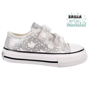 14169 Osito Zapatilla en textil metalizado. Estampado que brillan en la oscuridad. Forro textil. Velcro. Suela antideslizante.