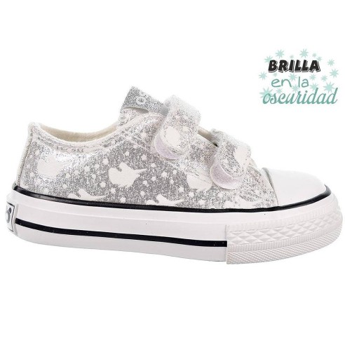 14169 Osito Zapatilla en textil metalizado. Estampado que brillan en la oscuridad. Forro textil. Velcro. Suela antideslizante.