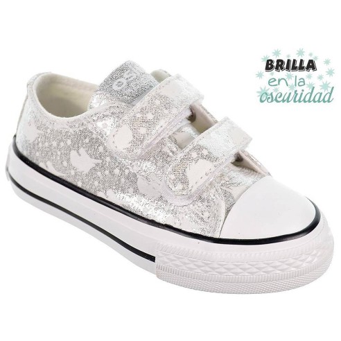 14169 Osito Zapatilla en textil metalizado. Estampado que brillan en la oscuridad. Forro textil. Velcro. Suela antideslizante.