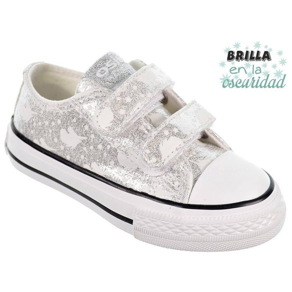 14169 Osito Zapatilla en textil metalizado. Estampado que brillan en la oscuridad. Forro textil. Velcro. Suela antideslizante.